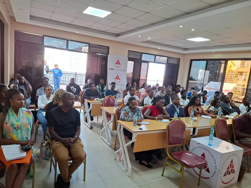 Members seated at tables at the AAK Members Forum, Blue Violets Plaza