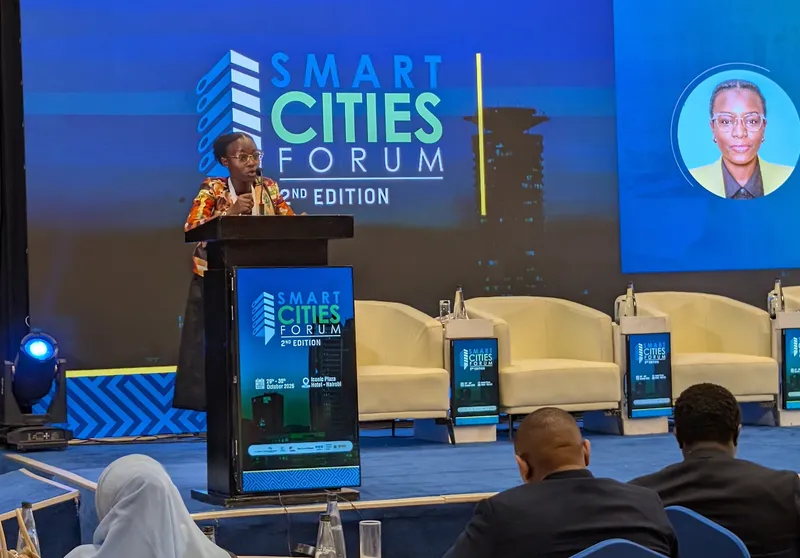 A speaker at the lectern of the Smart Cities Forum, 2nd edition, at Iconic Plaza Hotel, Nairobi, with delegates seated in front of the stage