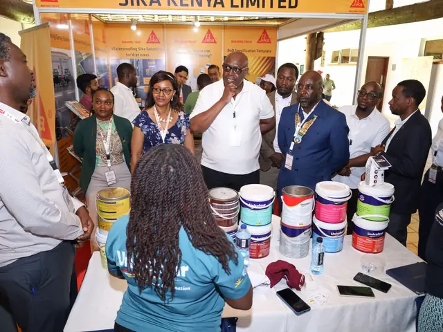 Delegates gather round a paint exhibitor's stand