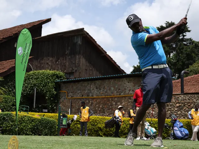 A golfer drives off the first tee
