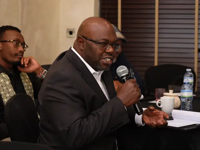 A participant makes a point during the discussion