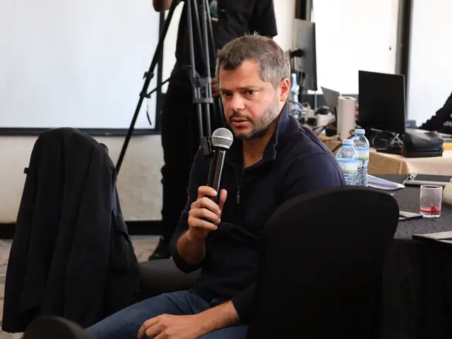 A participant responds from the floor