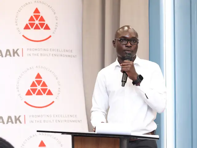 A speaker presents in front of the AAK banner