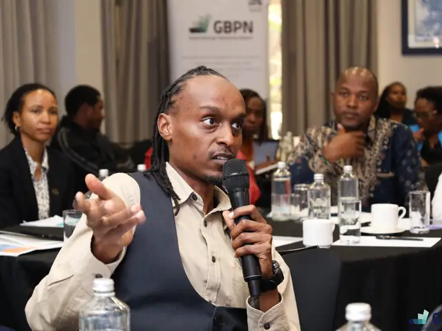 A participant makes a point during the discussion