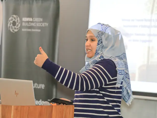 A speaker makes a point during her presentation