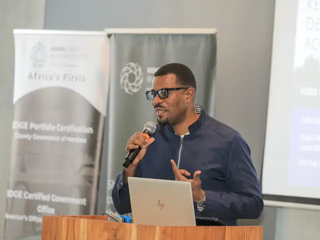 A speaker presents at the podium
