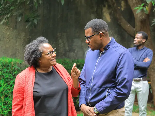Participants talk in the garden