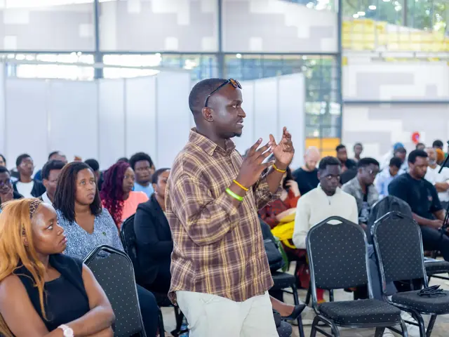 A participant asks a question from the floor