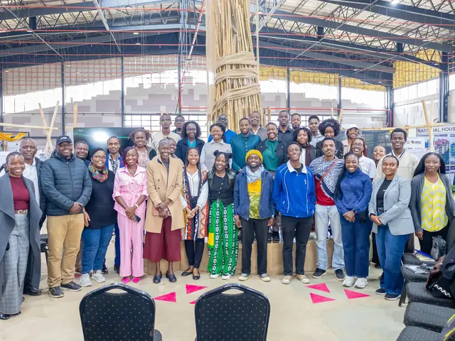 Participants in a group photo in the hall