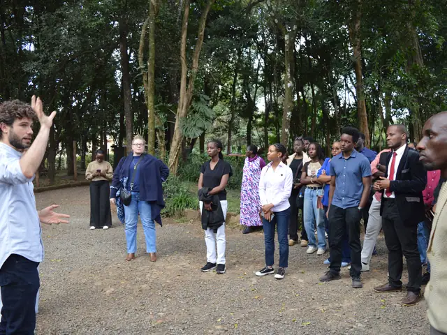 A guide points out features of the campus