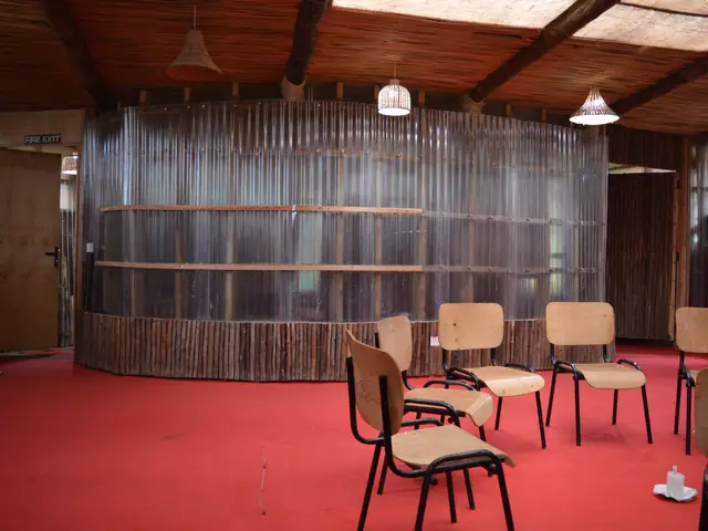 A classroom interior with timber walls and a band of clerestory glazing