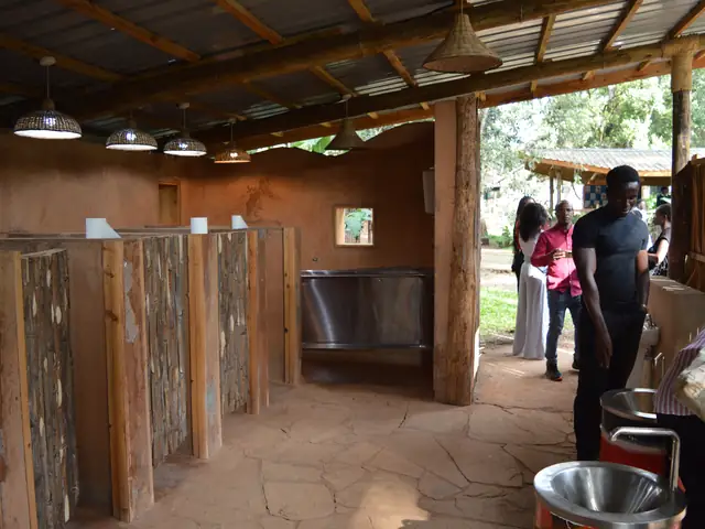 A timber-screened washroom block with steel basins