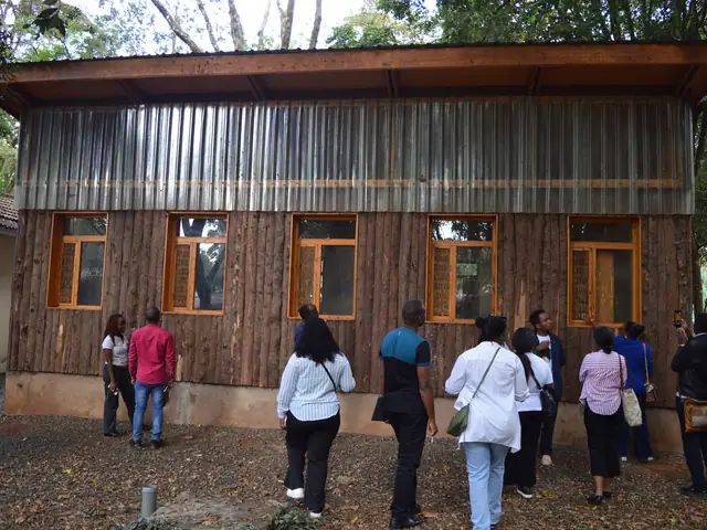Visitors outside a timber classroom block